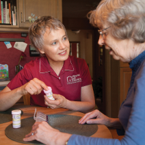 A caregiver and her patient discuss medication.